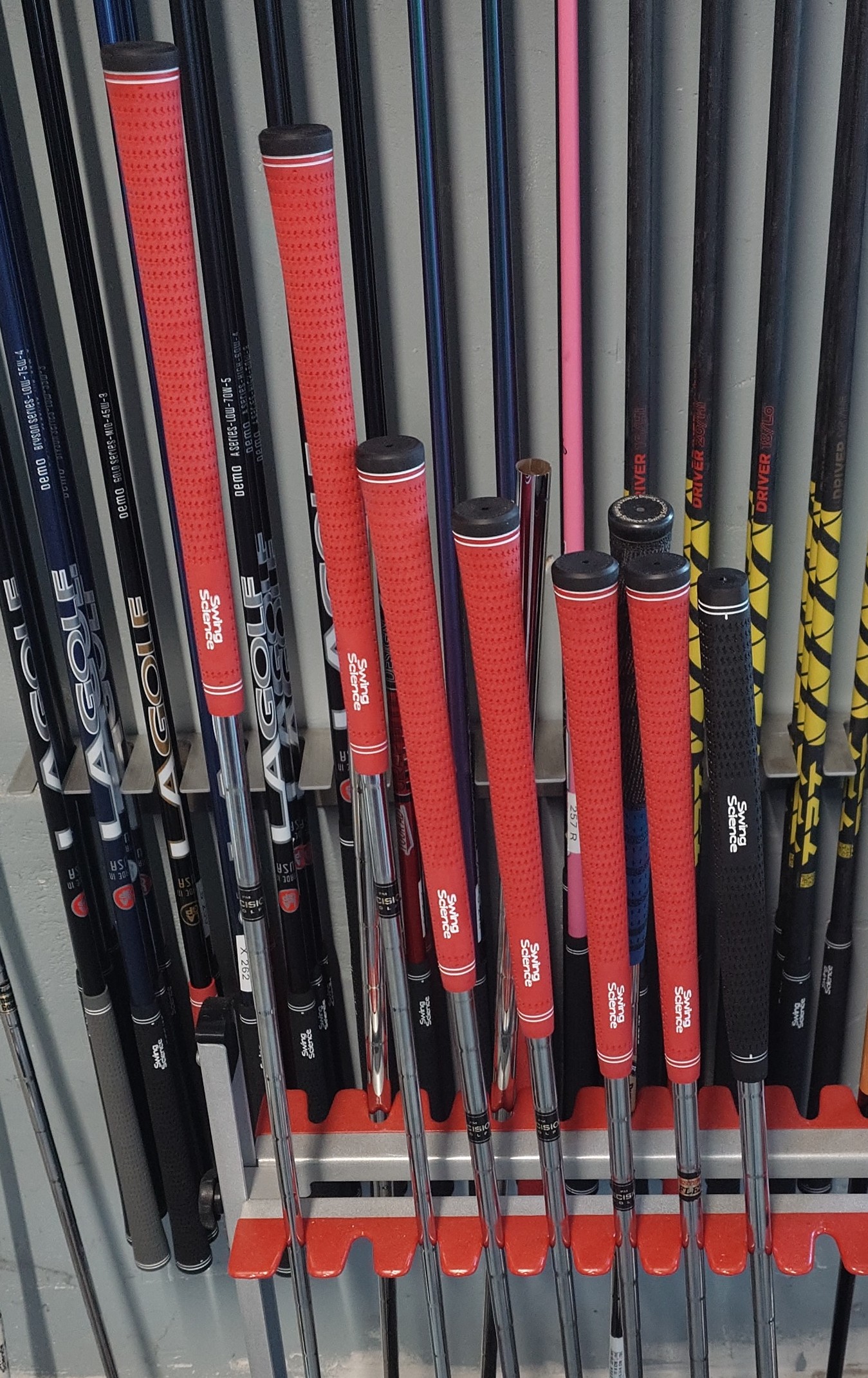 Customer regrip work with red Swing Science grips